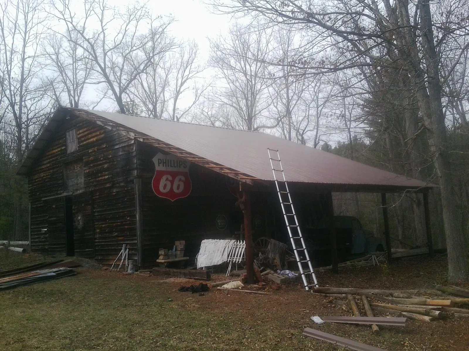 New metal roof on an open sided timber barn with a vintage sign in Philadelphia
